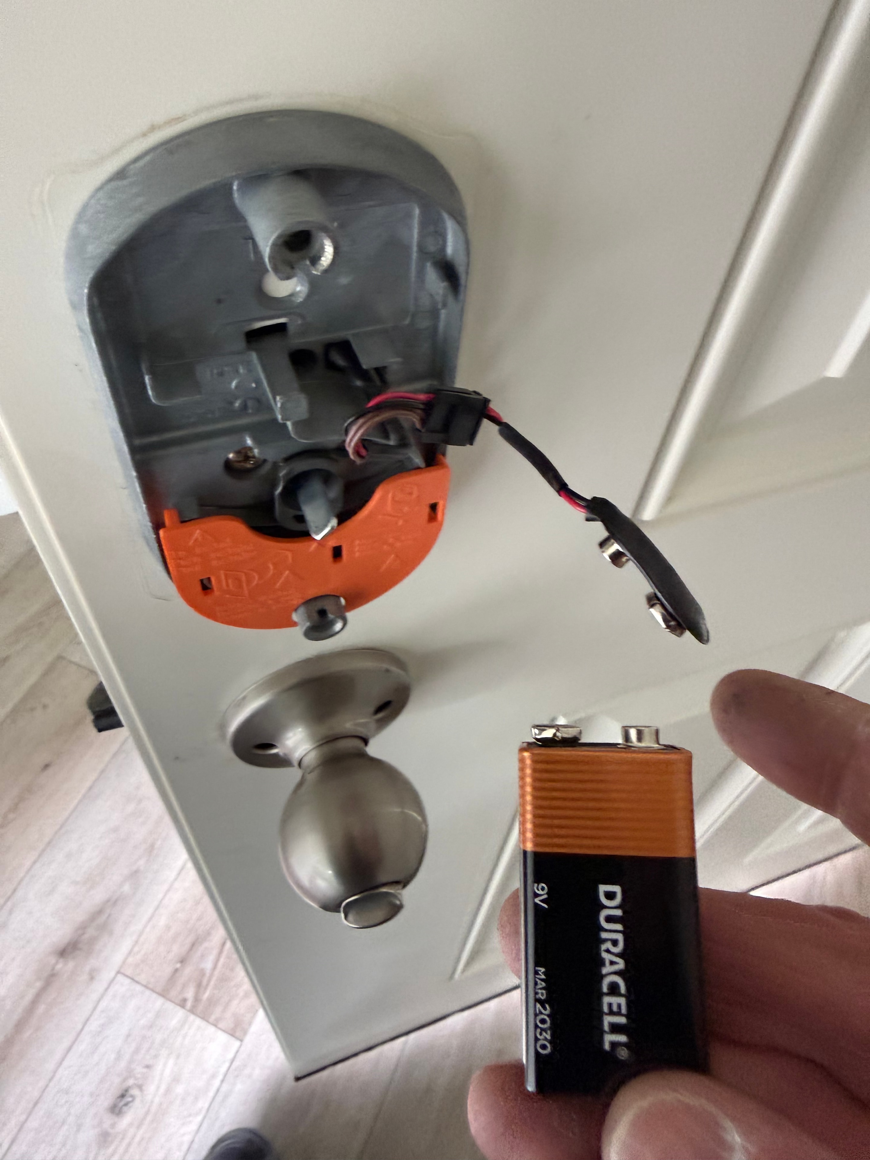 Locksmith replacing the 9V battery in a smart electronic deadbolt — residential locksmith service Vancouver WA
